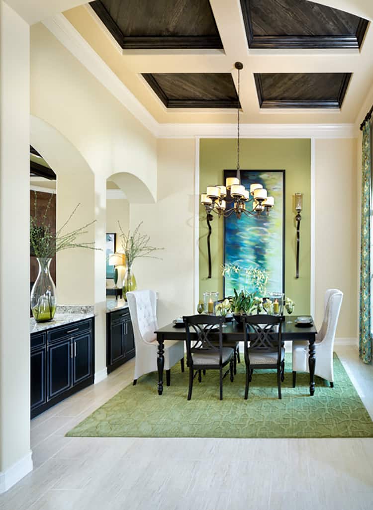 Large artwork behind dining room table - Photo by Mercedes Premier Homes