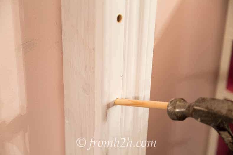 Use a hammer to push the dowels in