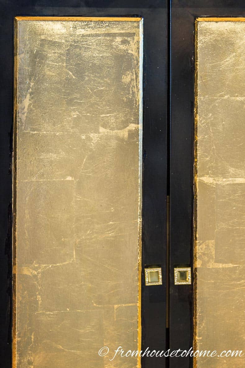 Gold foil on the doors of a cabinet