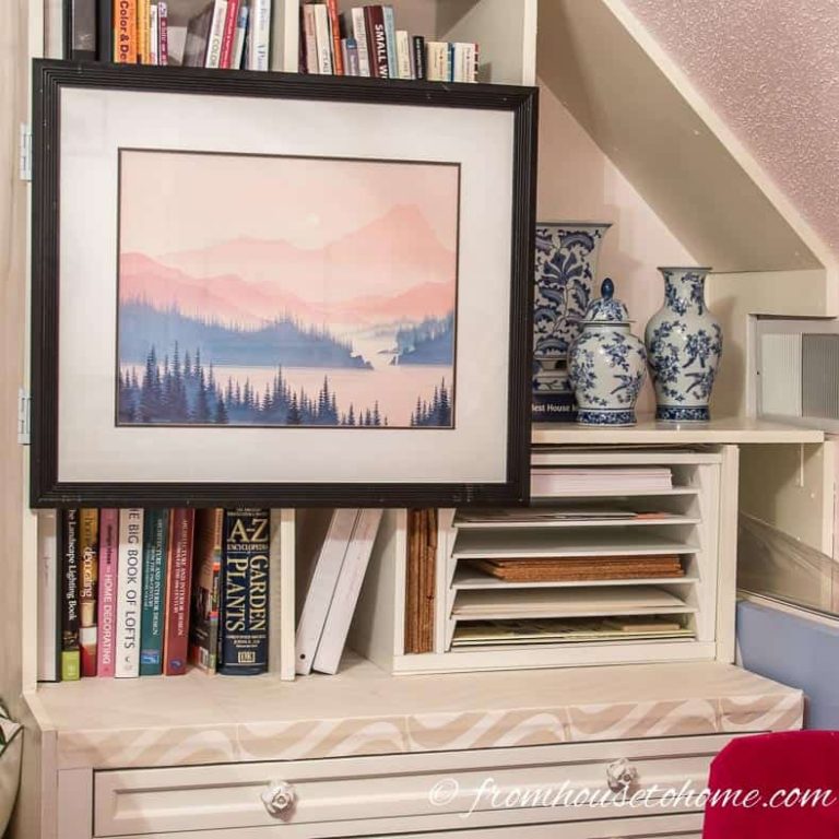 How To Hang Art On A Bookcase (And Still Have Easy Access To The Books)