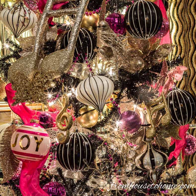 Kate Spade inspired Christmas tree | Looking for some glam gold Christmas tree ideas with a splash of pink? Learn how to decorate a Kate Spade inspired Christmas tree with these step-by-step instructions (and sources).