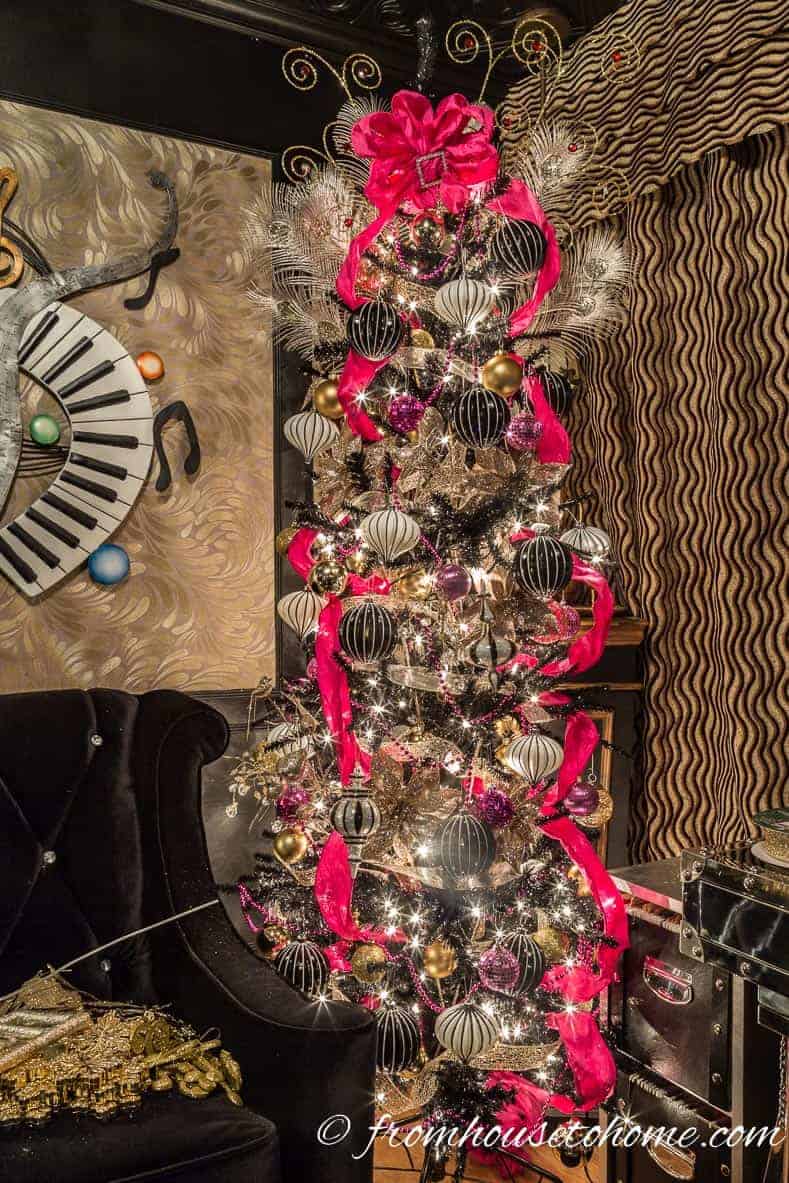 Add the black and white ornaments | Looking for some glam gold Christmas tree ideas with a splash of pink? Learn how to decorate a Kate Spade inspired Christmas tree with these step-by-step instructions (and sources).