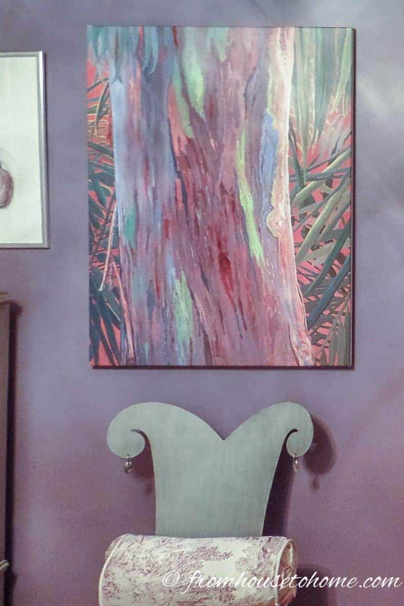 Contemporary artwork on a purple wall