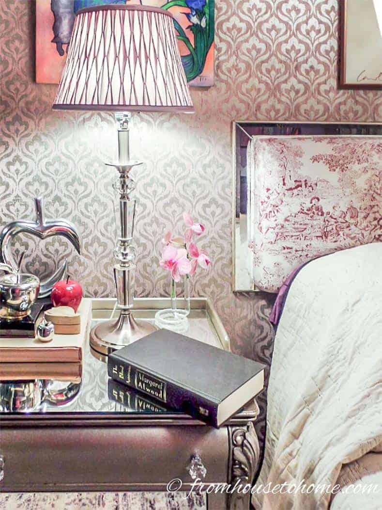 DIY mirrored nightstand with a lamp and a book