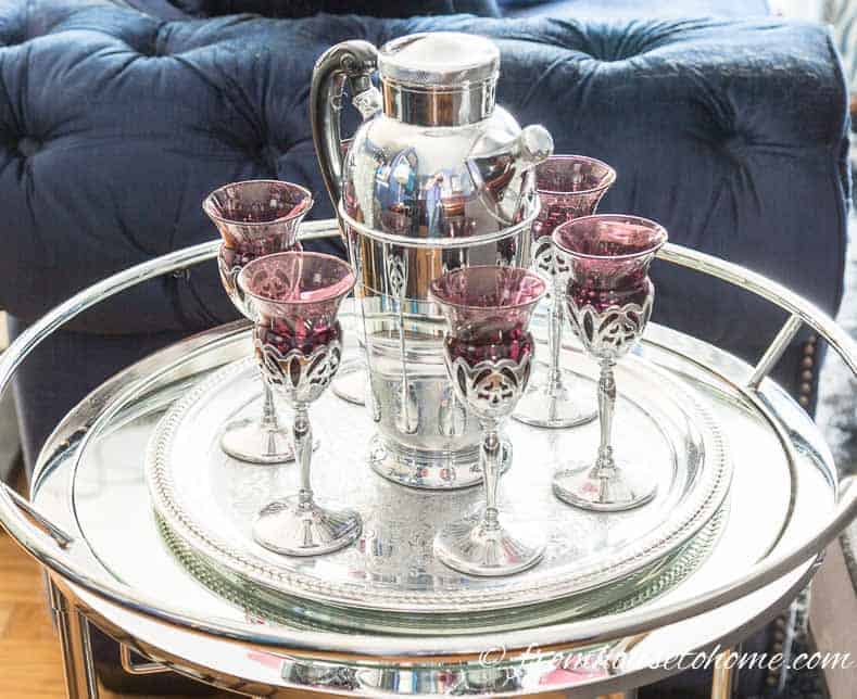 A silver tray with a mid-century cocktail set