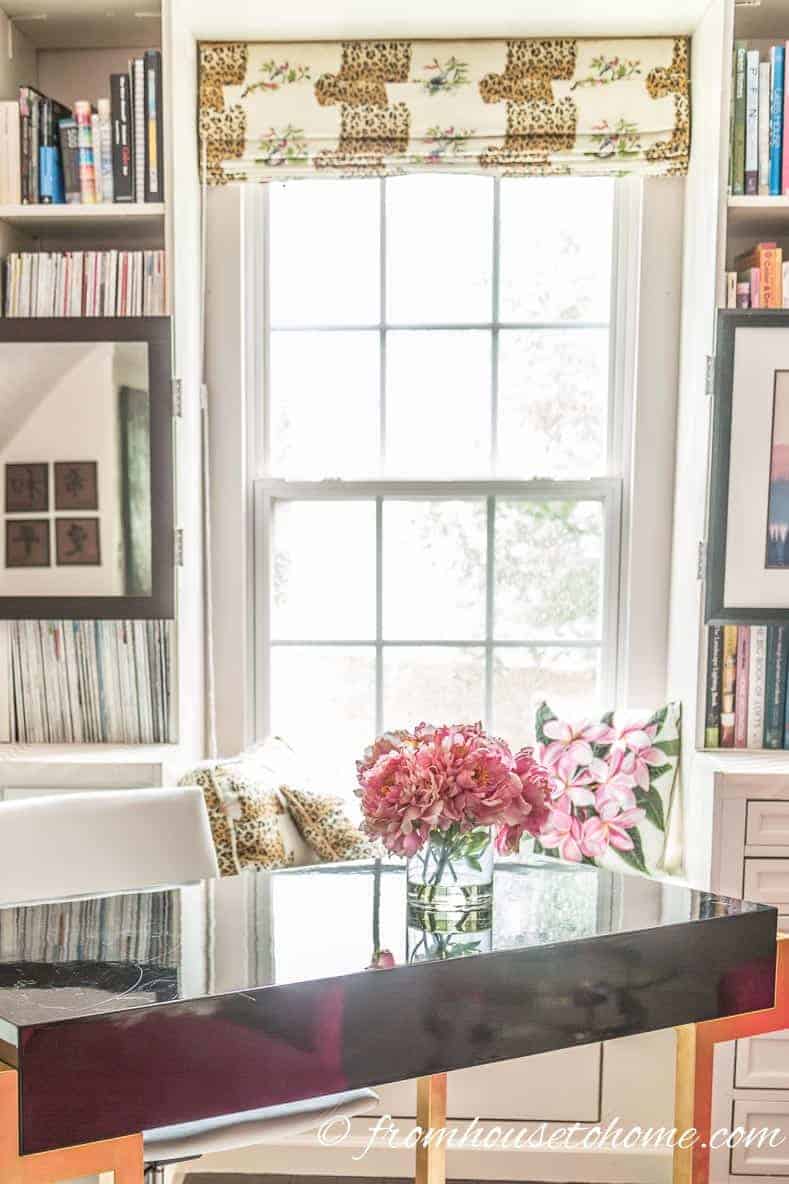 A tall window in a home office