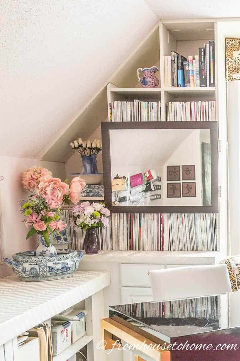 Home office shelves with the office equipment hidden by a picture