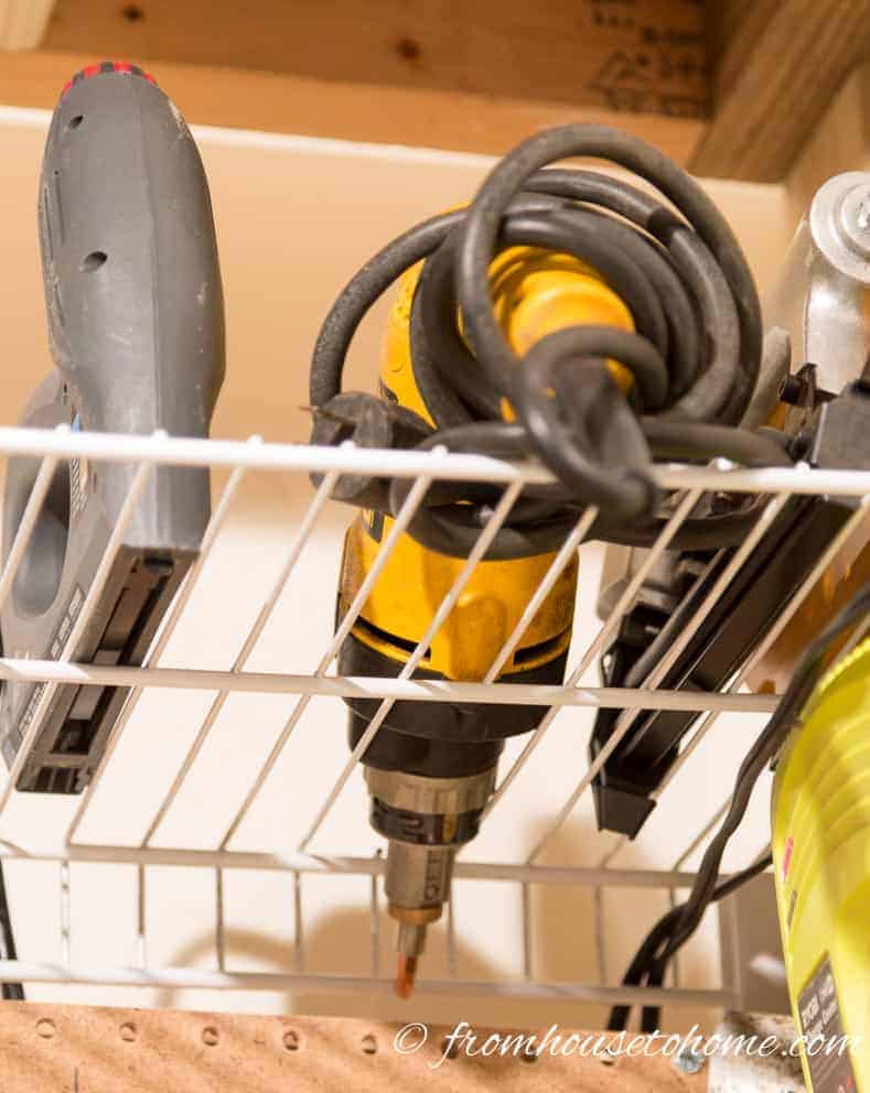 Take out some wires to make space for a drill | 7 clever wire shelving hacks that will get you organized | If you are looking for some DIY wire shelving hacks that are easy and inexpensive, this list of organization ideas will help you to repurpose those wire shelves.