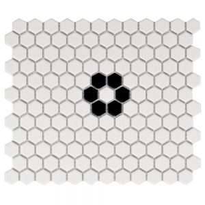 White hexagonal mosaic tiles with a single black flower in the middle