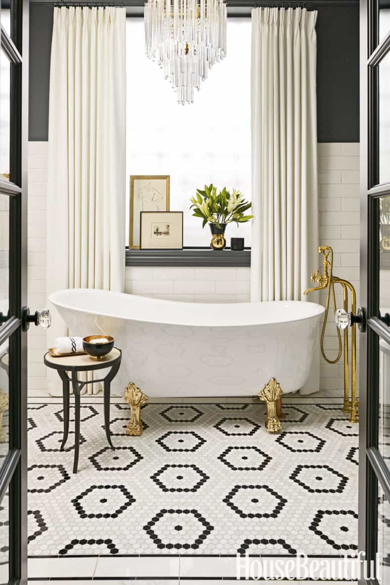 Glam black and white bathroom with gold accents and hexagonal pattern floor tiles