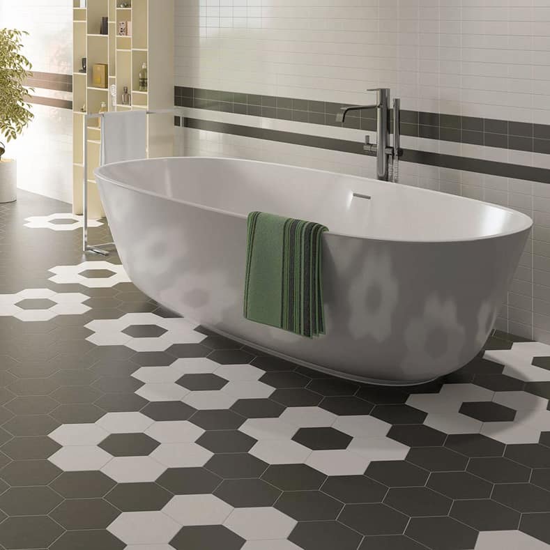 Contemporary bathroom with a black and white hexagonal tile floor laid in a floral pattern