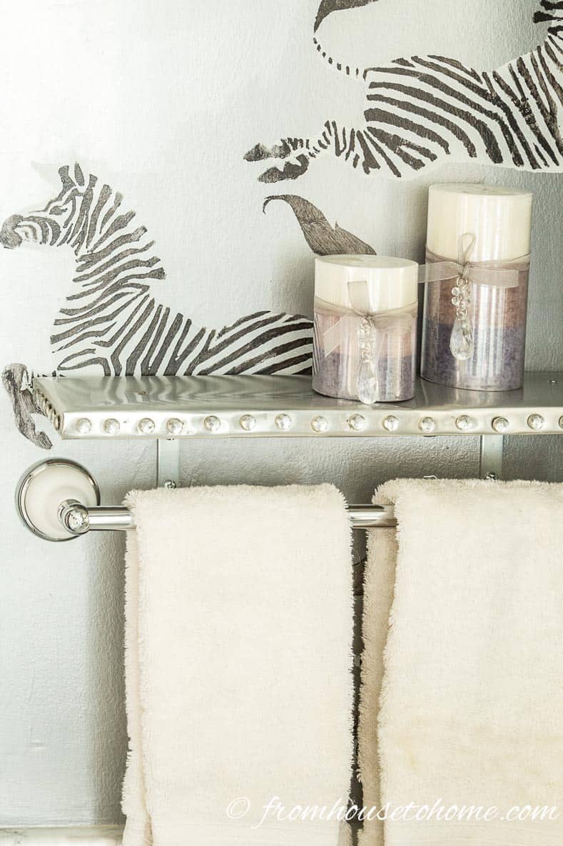 DIY silver shelf edged with crystal upholstery tacks