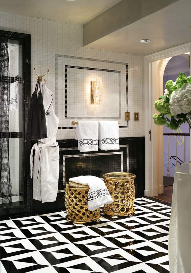 Black and white bathroom with geometric tile floor via Jamie Herzlinger