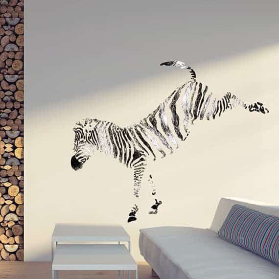 large zebra painted on a living room wall with a stencil