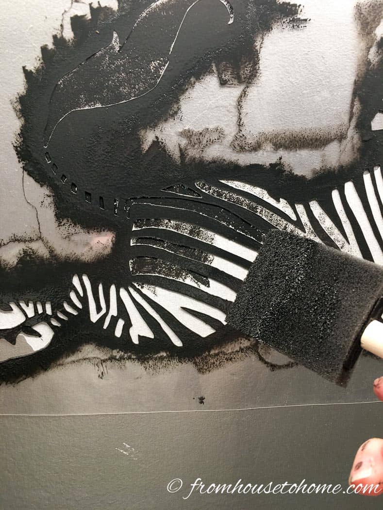Painting black for the stripes on the zebra stencil