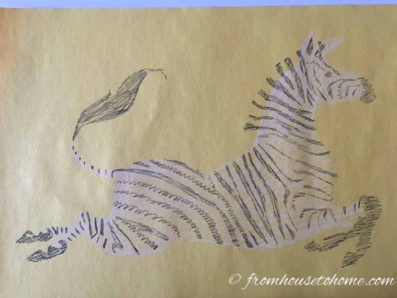 The stenciled zebra on a piece of construction paper