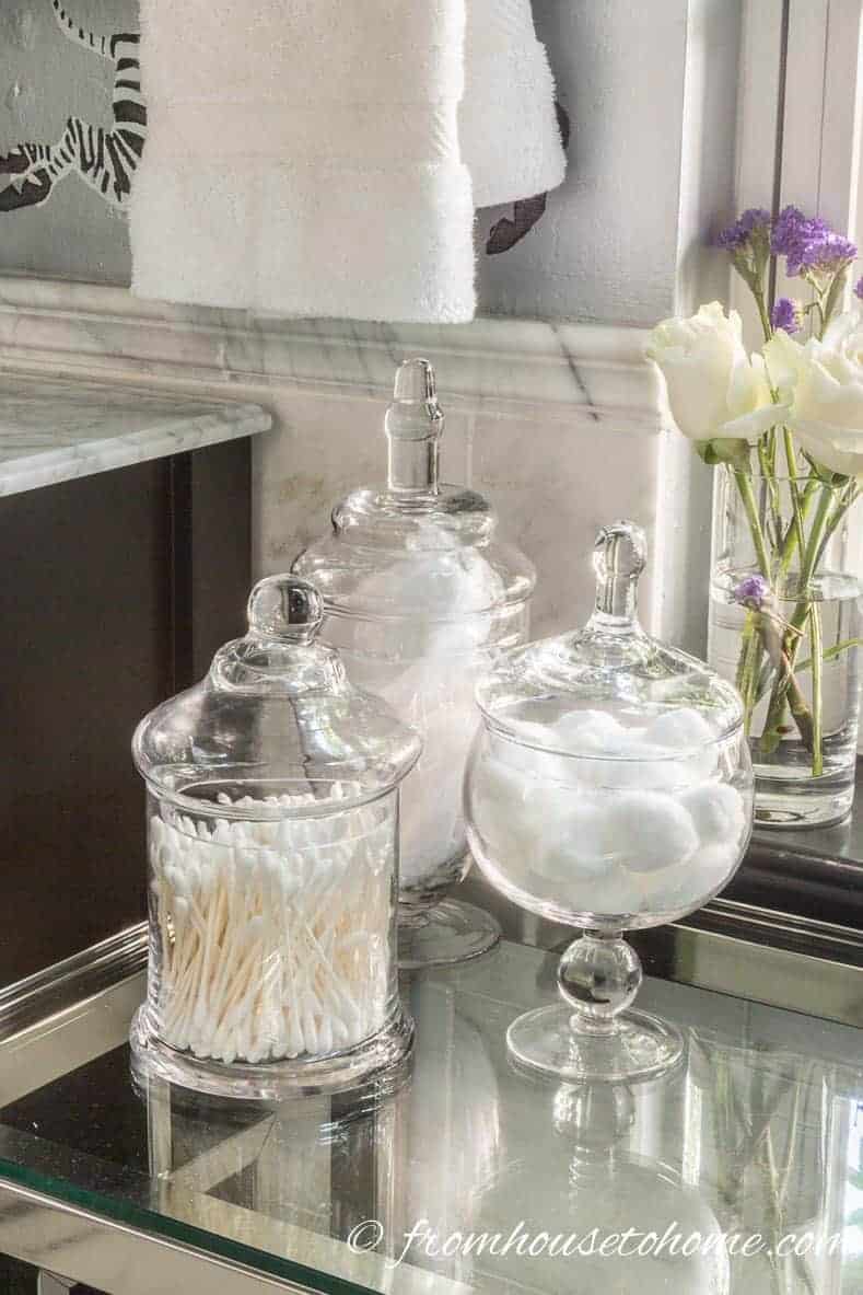 Glass apothecary jars used for bathroom storage