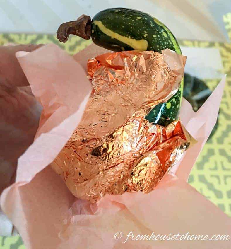 This tutorial for making DIY copper leaf fake pumpkins is the BEST! I love that I can upgrade my ugly faux pumpkins into trendy copper ones without spending a lot of money. Perfect for fall decorating! Definitely pinning! #pumpkin #falldecorating #falldecor