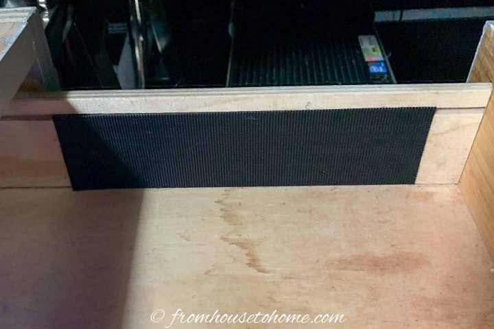Velcro attached to the inside of a desk drawer