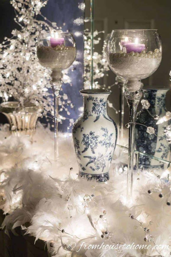 The feathers almost look like snow in the lights | Blue and white Christmas home decorating ideas