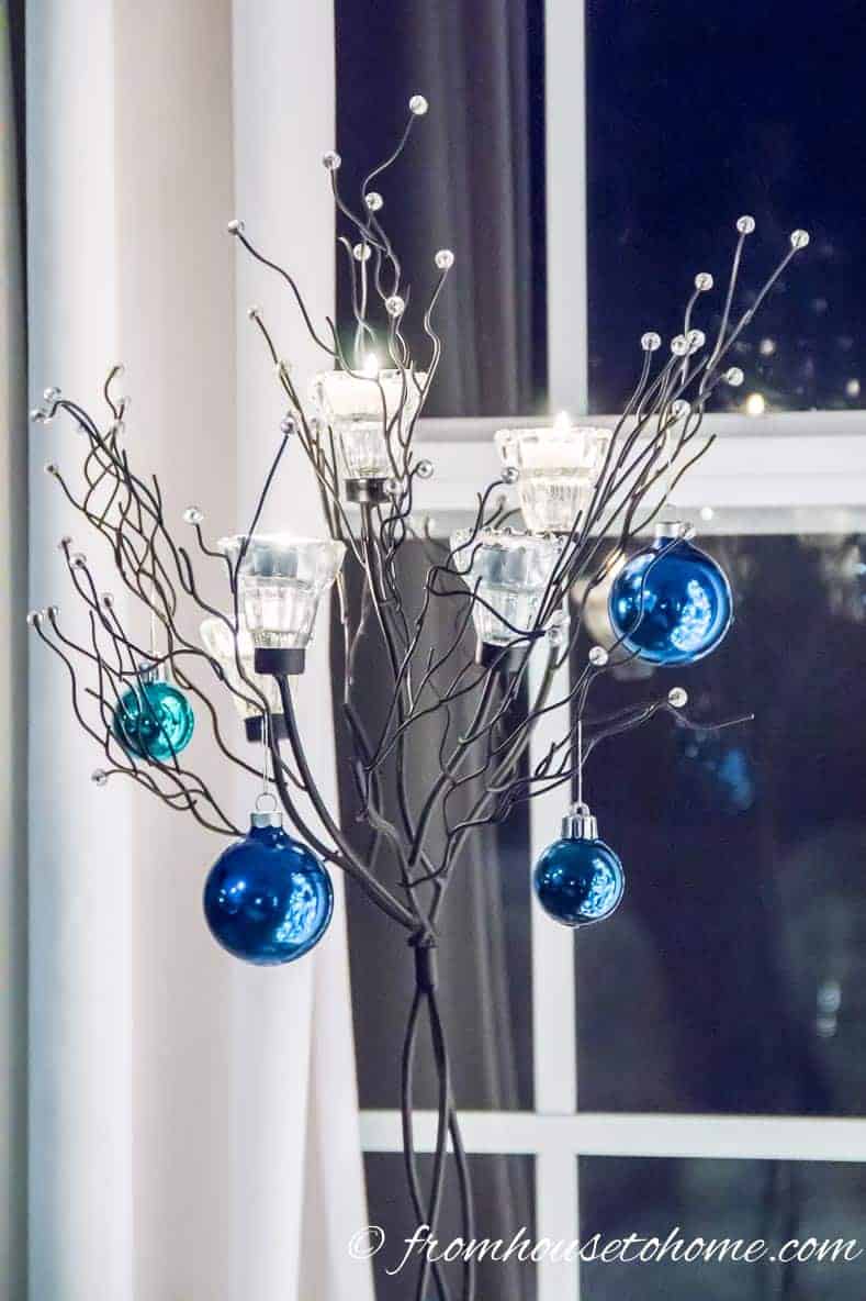 A twig tree with blue Christmas Ornaments