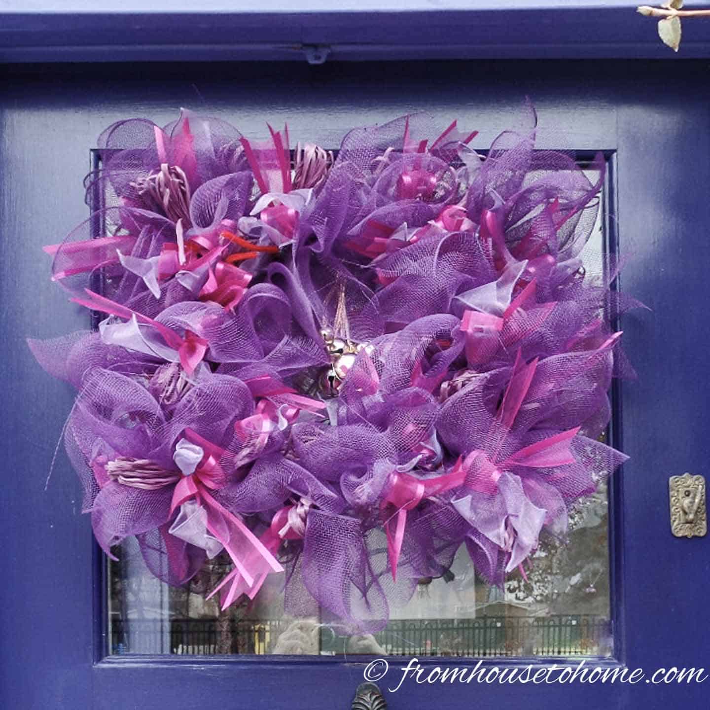 Pink and purple creative Christmas wreath on door