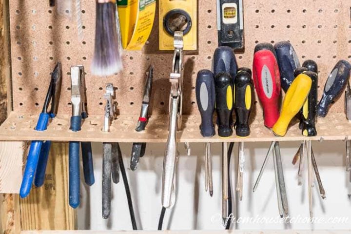 Use a pegboard shelf for storing screwdrivers and plier