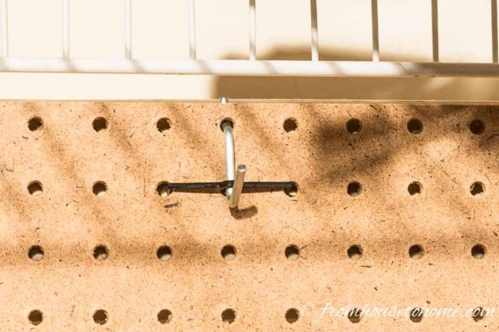 Use pegboard hooks with tie downs