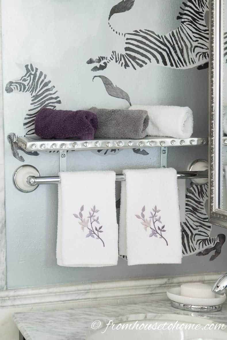 DIY shelf with aluminum flashing and crystal upholstery tacks