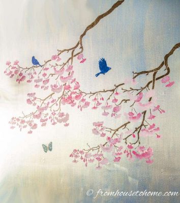 silver wall painted with cherry blossom stencil