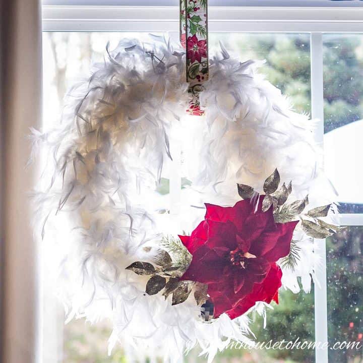 DIY white feather Christmas wreath hung in window
