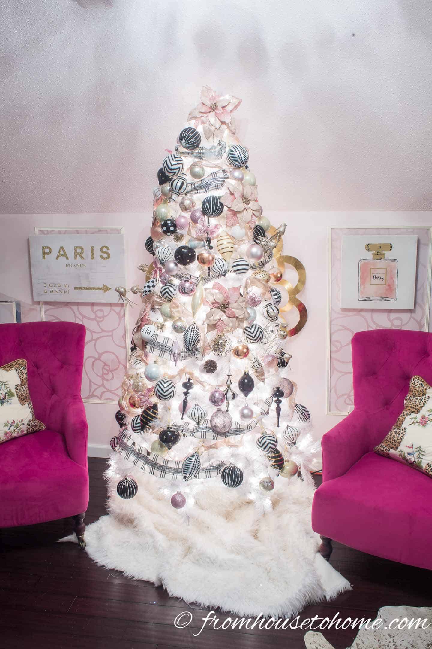 Pink, black and white Christmas tree in a pink room