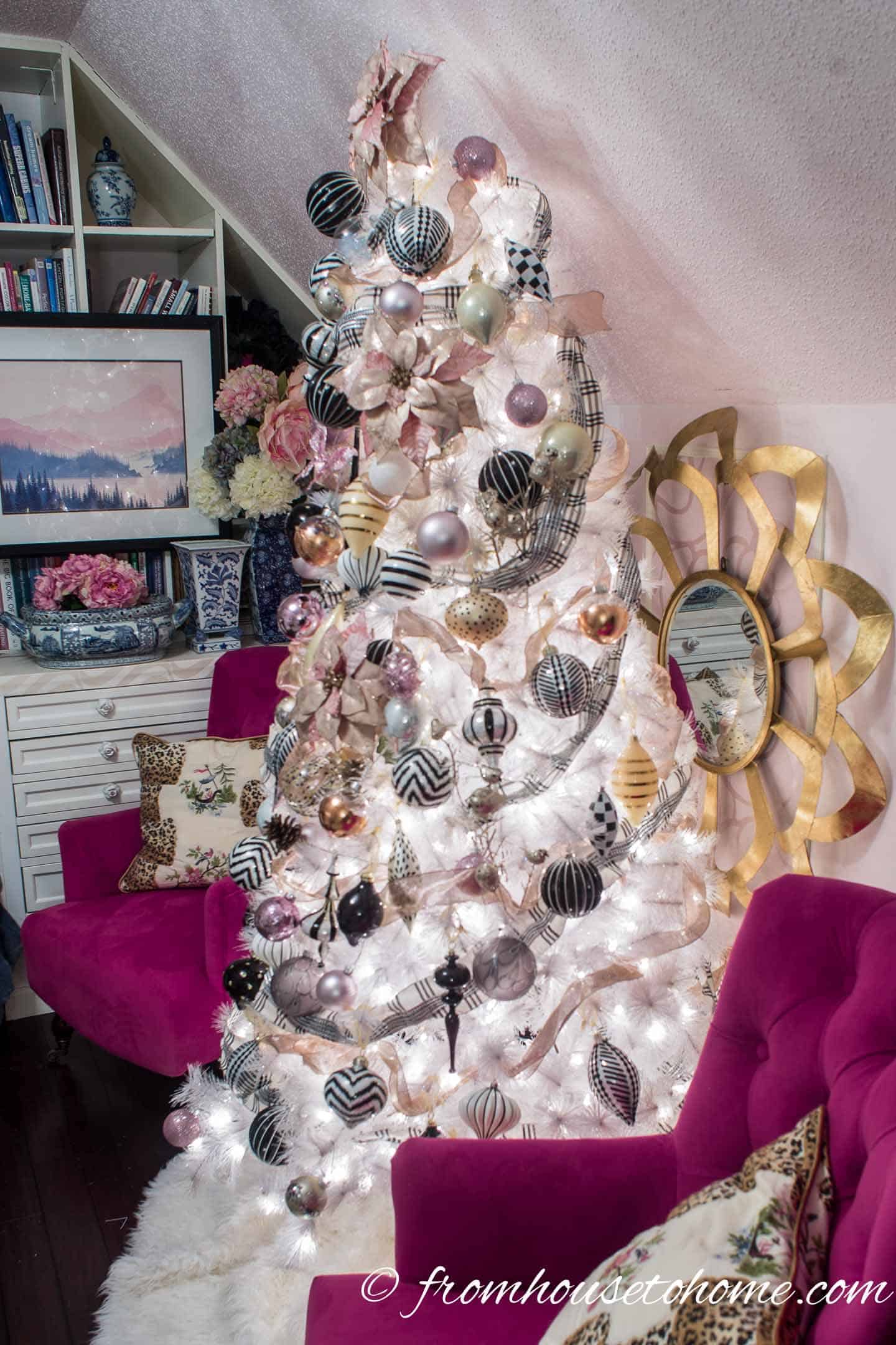 White Christmas tree with blush pink, black and white Christmas ornaments