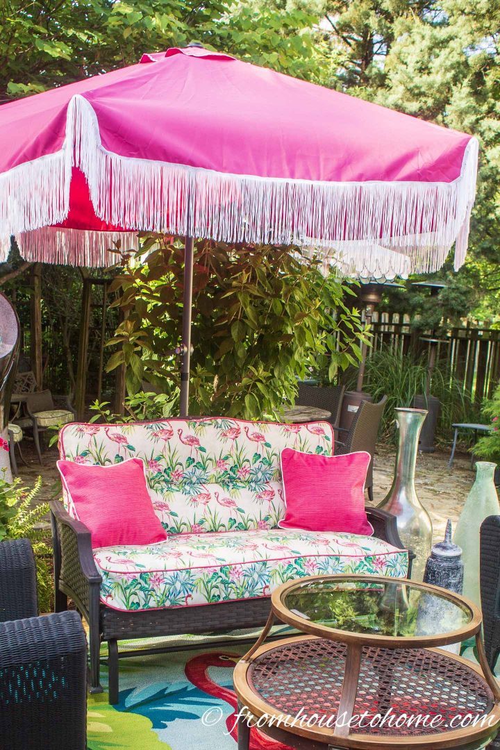 Pink patio umbrella with fringe added