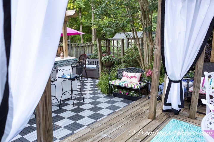 Black and white deck tiles installed in a checkerboard pattern