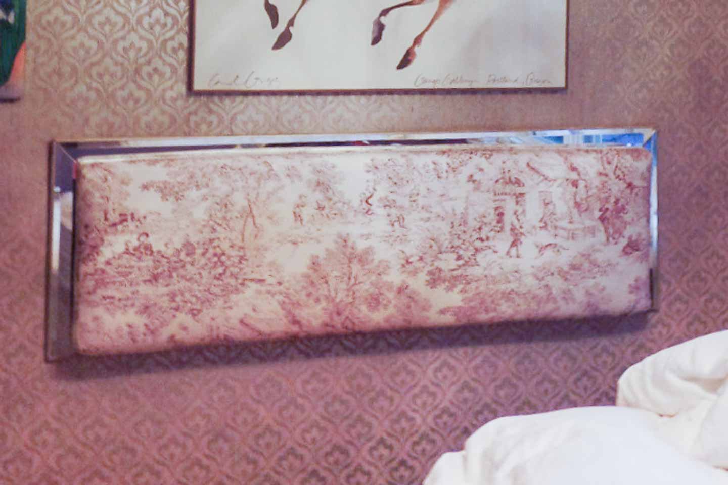 Headboard hung on the wall