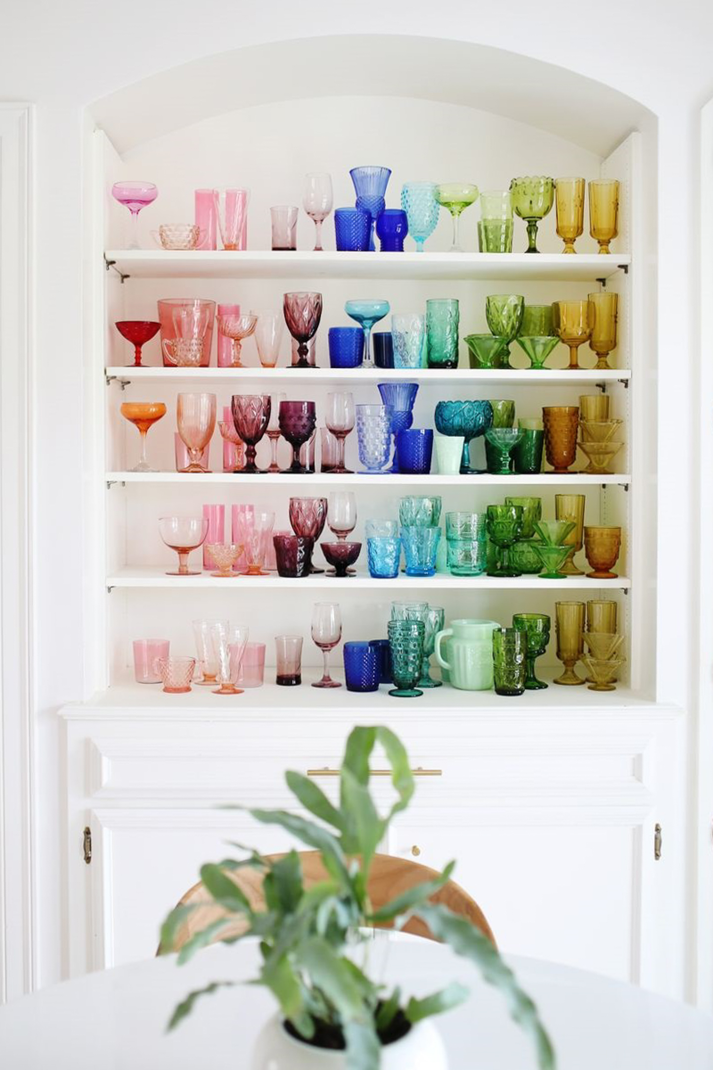 White shelf with colored glass