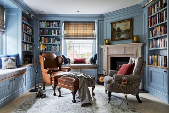Small home library in a living room with a fireplace