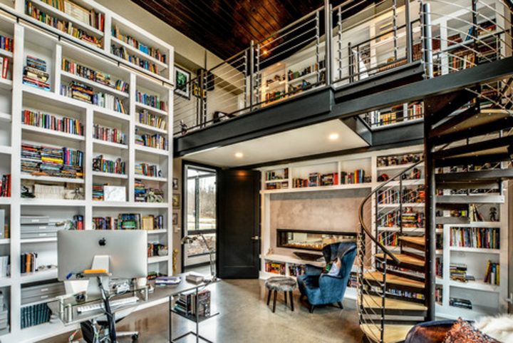 Modern home office library with wall to wall bookshelves