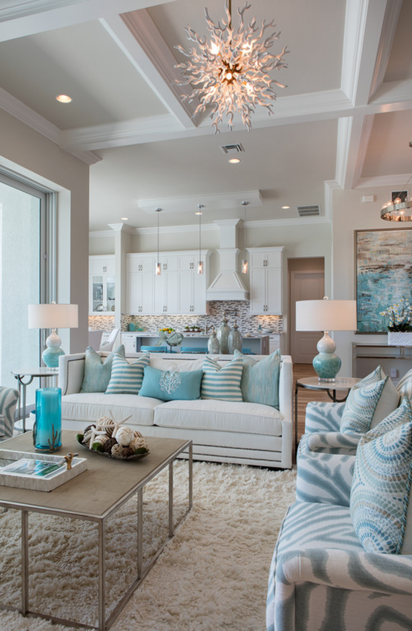 Coastal themed living room with two sofas around a square coffee table