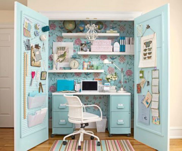 Closet home office with pegboard and bulletin board on the doors