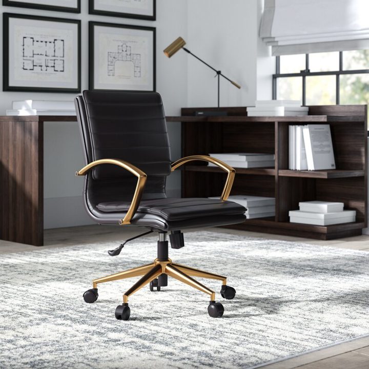 Black desk chair with gold legs and arm rests