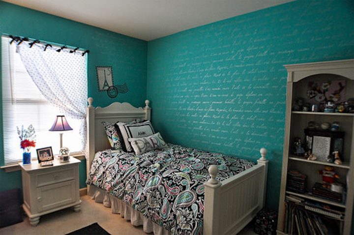 Bedroom with script writing stenciled on the wall in silver paint via houzz.com