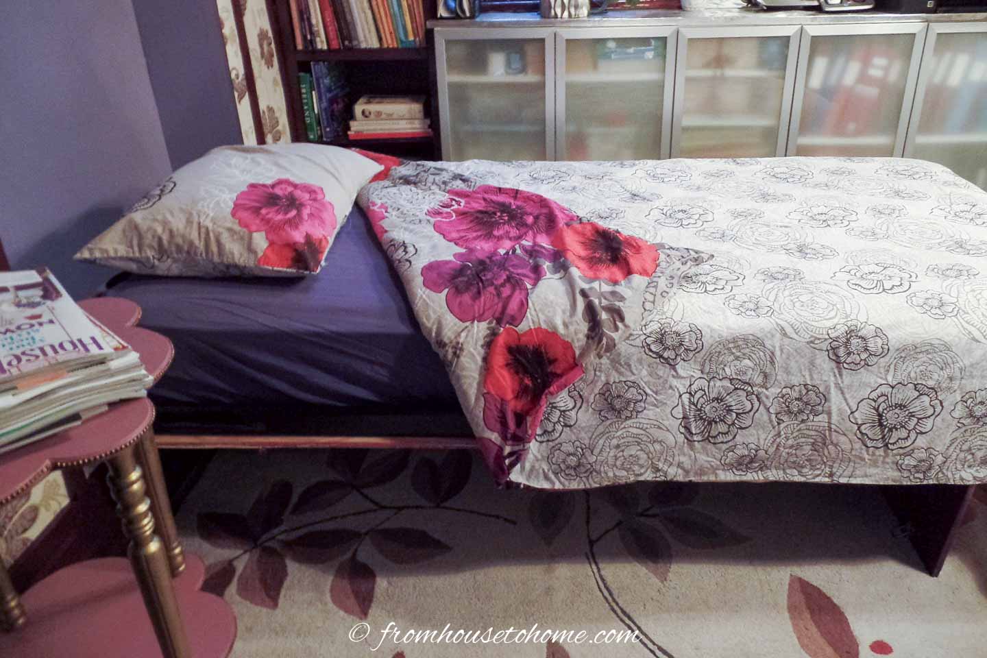 Murphy bed built into the wall in a small bedroom