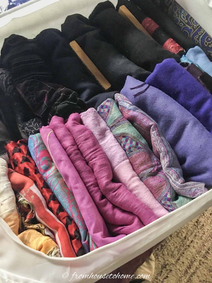 Clothes folded and stored vertically in a zippered cloth storage bin