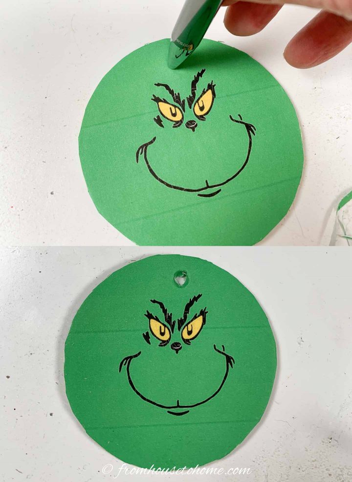 How to punch the hole at the top of the DIY Grinch Christmas ornaments