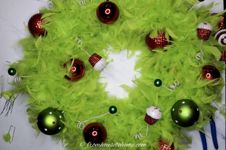 DIY Grinch wreath with the ball ornaments and swirl picks