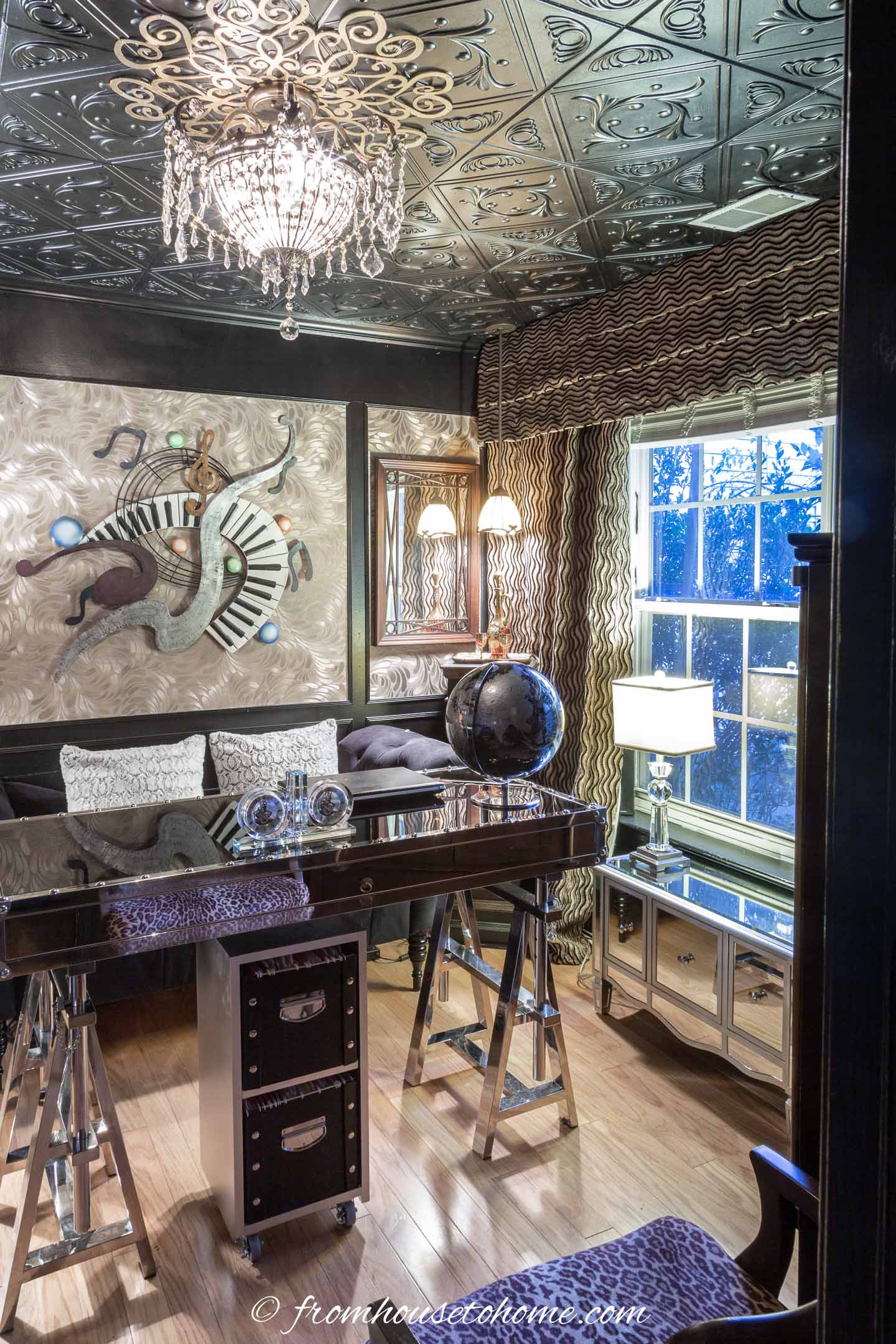 Black ceiling in a black and gold home office