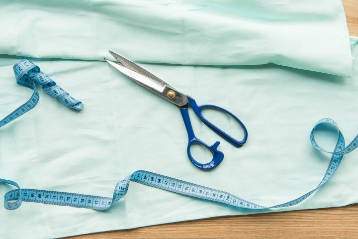 fabric with scissors and a measuring tape
