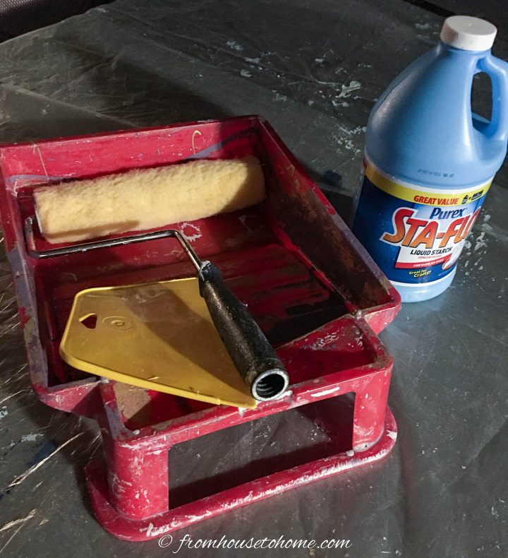 Supplies for applying fabric to a wall using liquid starch